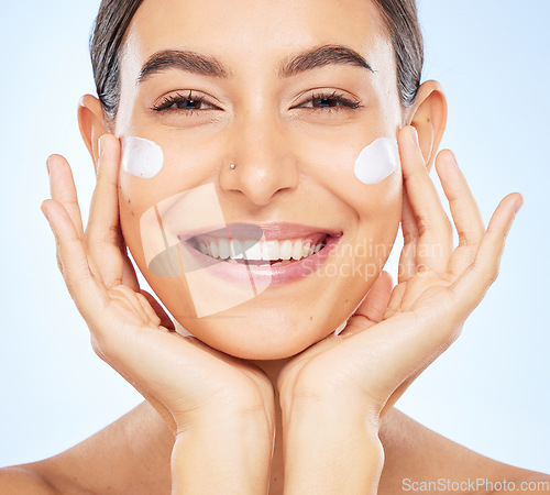 Image of Portrait, skincare and moisturizer with a model woman in studio on a gray background for antiaging beauty. Face, lotion and product with an attractive young female inside to apply facial treatment