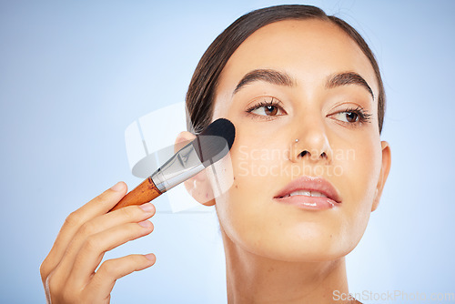 Image of Beauty, brush or woman in a makeup skincare daily routine for a beautiful glowing smooth face in studio. Colombia, facial or young girl model applying cosmetics products for self love or self care