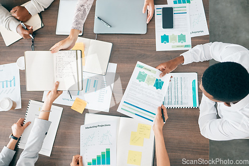 Image of Collaboration, documents and financial with a business team working together in an accounting office from above. Meeting, data and finance planning with a man and woman accountant group at work