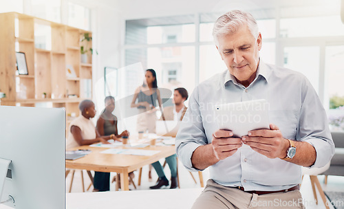 Image of Tablet, business and senior man in office reading email, researching or internet browsing. Technology, company and elderly male employee with touchscreen for web scrolling, networking or fintech app.