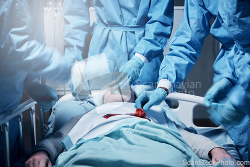 Image of Doctors, surgery and blood with a medicine team in scrubs operating on a man patient in a hospital. Doctor, nurse and teamwork with a medical group in a clinic to perform an operation