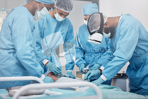 Image of Doctors, surgery and collaboration with a medicine team in scrubs operating on a man patient in a hospital. Doctor, nurse and teamwork with a medical group in a clinic to perform an operation