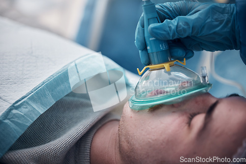 Image of Anesthesia, oxygen mask and medical with man in surgery for breathing, ventilation and operation. Healthcare, cardiology and paramedic with face of patient and doctors in operating room for emergency