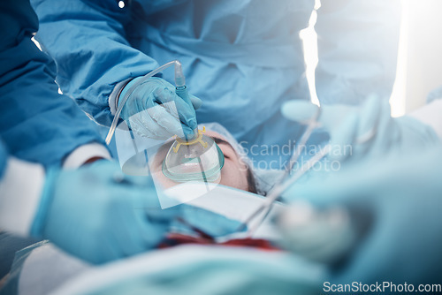 Image of Doctors, surgery and oxygen mask with a medicine team in scrubs operating on a man patient in a hospital. Doctor, nurse and teamwork with a medical group in a clinic to perform an emergency operation