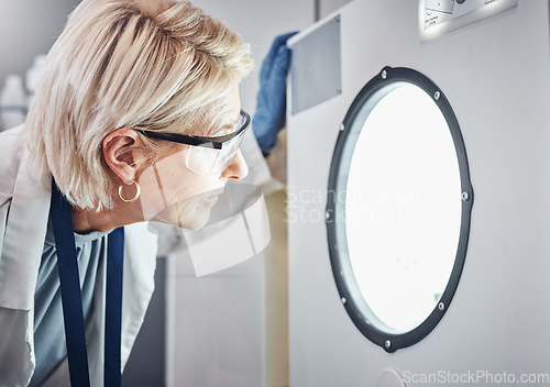 Image of Scientist, worker or laboratory autoclave equipment in medical research, vaccine temperature control or dna engineering. Zoom, thinking face or mature woman or science centrifuge machine for medicine