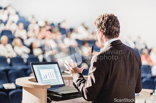 Image of Speaker at Business Conference and Presentation.