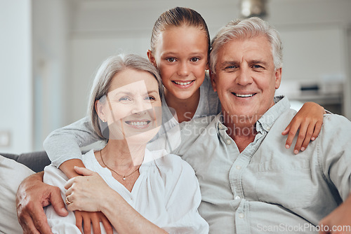 Image of Love, family and portrait by girl and grandparents on sofa for bond, hug and quality time in their home together. Happy family, face and senior man with woman relax with grandchild while babysitting