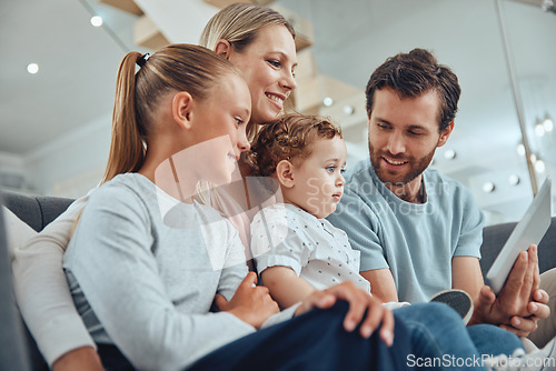 Image of Living room, tablet and happy family streaming a movie online while relaxing on a sofa together at home. Mother, father and children watching video on social media or the internet with mobile device.