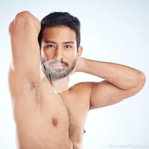 Image of Man, body or stretching arms on studio background in workout tension release, exercise pain relief or training healthcare wellness. Portrait, sports athlete or fitness model warm up of strong muscles