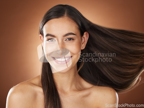 Image of Face portrait, hair care and beauty of woman in studio isolated on a brown background. Wellness, hairstyle and aesthetics of female model with healthy and long hair after salon treatment for growth.