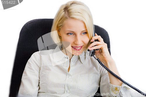 Image of Young businesswoman talk on the phone in the office