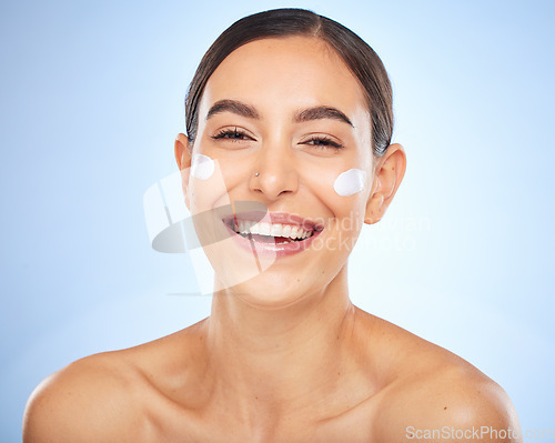 Image of Portrait, skincare and moisturizer with a model woman in studio on a gray background for antiaging beauty. Face, lotion and product with an attractive young female inside to apply facial treatment