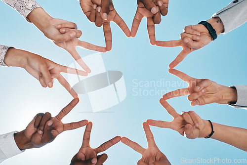 Image of Team building, blue sky or hands with peace sign for support, teamwork or partnership collaboration. Low angle, trust or fingers showing hope, faith or community group solidarity with mission goals