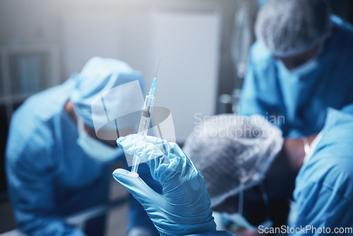 Image of Doctors, nurses or hands with surgery needle in anesthesia treatment, morphine pain killer or narcan adrenaline for patient. Zoom, healthcare worker or medicine syringe for operation medical teamwork