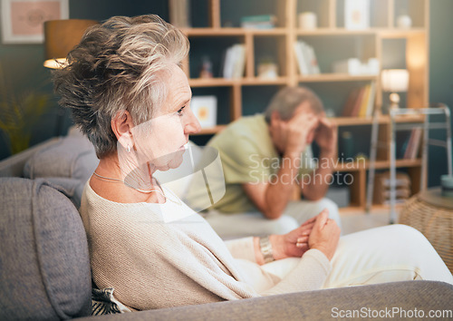 Image of Divorce, stress or old couple in counseling therapy for helping advice in a toxic marriage relationship. Conflict, fighting or sad old woman thinking on sofa with an unhappy or upset senior partner