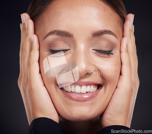 Image of Face, beauty skincare and woman with eyes closed in studio on a dark background. Makeup, cosmetics and happy female model feeling good with hands on head after spa facial treatment for healthy skin.