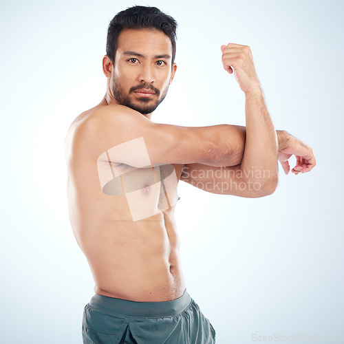 Image of Man, body or stretching arms on studio background in workout start, exercise pain relief or training healthcare wellness. Portrait, sports athlete or fitness model warm up of strong muscles