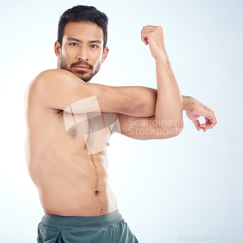 Image of Man, body or stretching arms on studio background in workout start, exercise pain relief or training healthcare wellness. Portrait, sports athlete or fitness model warm up of strong muscles