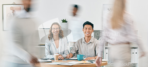 Image of Team work, portrait or business people in a busy office working on administration, documents or paperwork. Motion blur, collaboration or employees meeting for sales growth strategy or happy smile