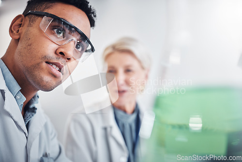 Image of Face, doctors and beaker in laboratory for research, testing and analysis. Science, innovation and teamwork of man, senior woman and researchers with goggles looking at glass flask for experiment.