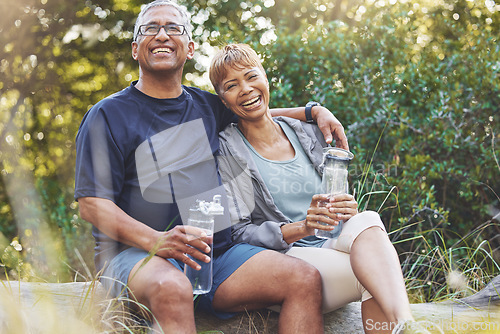 Image of Nature, hiking and portrait of a senior couple resting while doing outdoor walk for exercise. Happy, smile and elderly man and woman in retirement trekking together for wellness in a forest in Brazil