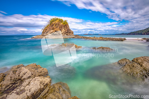 Image of Long exposure, pacific ocean waves on rock in Playa Ocotal, El Coco Costa Rica