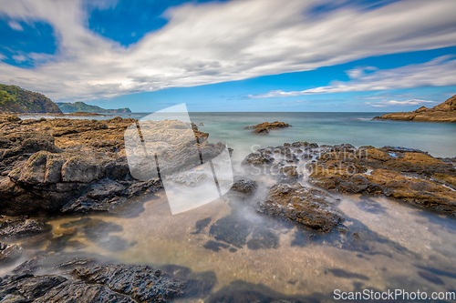 Image of Long exposure, pacific ocean waves on rock in Playa Ocotal, El Coco Costa Rica