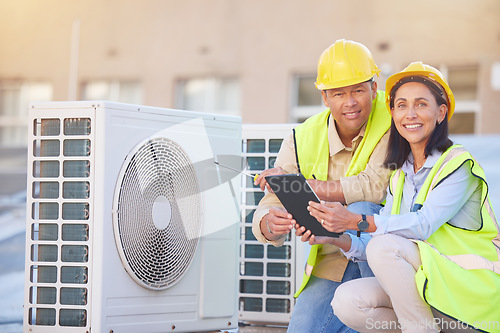 Image of Air conditioner, building maintenance and teamwork with tablet, smile and development with engineer team. Engineering man, repair woman and digital tech in portrait with collaboration for ac repair