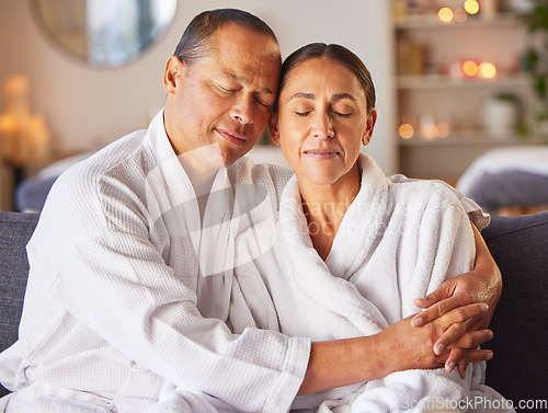 Image of Hug, relax and mature couple at a spa with zen, calm and stress free mindset before a treatment. Man and woman embracing with love while relaxing at luxury health, wellness and beauty salon together.