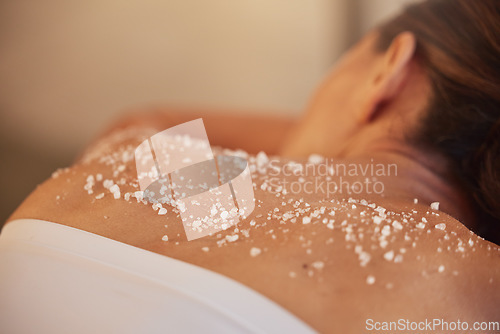 Image of Skincare, spa and woman with salt, luxury and massage back at resort. Female enjoy scrubbing, lady and beauty salon to relax, health and dermatology for exfoliating, skin wellness and natural care.
