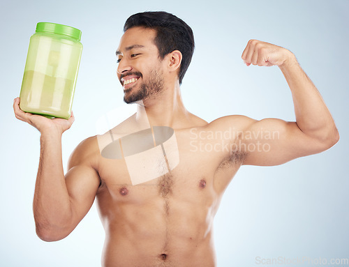 Image of Fitness, man and protein powder for muscle gain, diet and weight loss on grey studio background. Male, athlete and body builder for sports nutrition container, supplement and healthy energy drink.