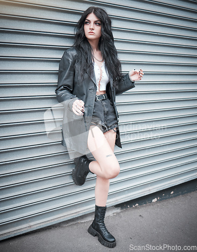 Image of Young woman, fashion and streetwear with gen z punk style, outdoor and trendy, edgy and stylish in urban city. Youth, focus and beauty with rock aesthetic, fashion model in designer clothes in London