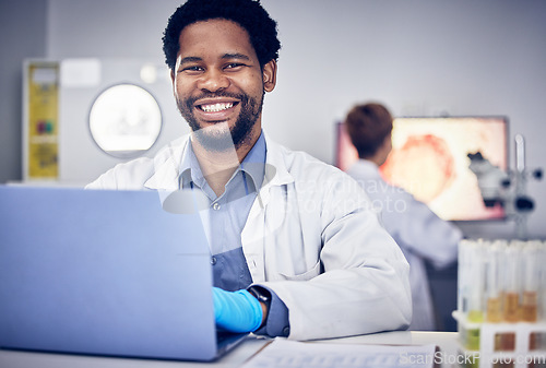 Image of Portrait, scientist and black man with laptop, laboratory and research for healthcare. Male, researcher or science for medical diagnosis, cure and online analysis for data, sample and innovation tech