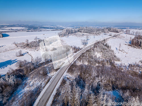 Image of Aerial view of winter road, in sunny day