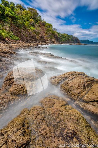 Image of Long exposure, pacific ocean waves on rock in Playa Ocotal, El Coco Costa Rica