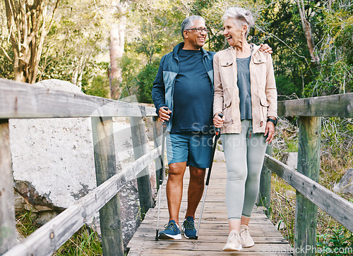 Image of Relax, senior or couple of friends hiking, walking or trekking for freedom, exercise or fitness in nature forest. Interracial, travel or happy woman enjoys bonding time with healthy elderly partner