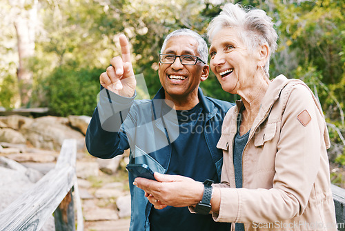 Image of Relax, senior or couple of friends hiking, walking or trekking for freedom, exercise or fitness in nature forest. Interracial, travel or happy woman enjoys bonding time with healthy elderly partner