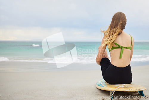Image of Beach, fitness or woman with surfboard, freedom or calm peace watching the relaxing ocean waves on holiday vacation. Travel, back view or healthy girl athlete thinking of surfing goals or training