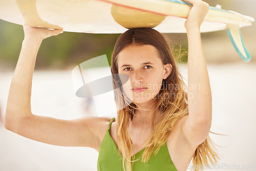 Image of Woman, portrait and surfer with surfboard at beach, travel and fitness with adventure, exercise and ready to surf in Hawaii. Young girl on holiday, workout and nature with extreme sport and wellness.