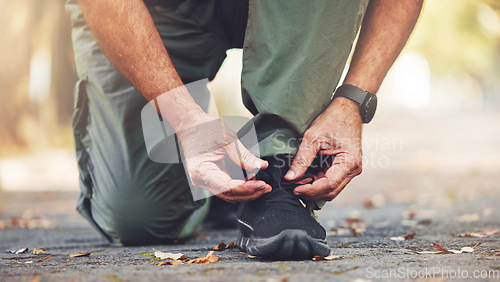 Image of Fitness, road or hands tie shoes for running exercise, workout or training on street, ground or asphalt. Footwear, start or healthy old mans legs ready for walking, trekking or exercising challenge