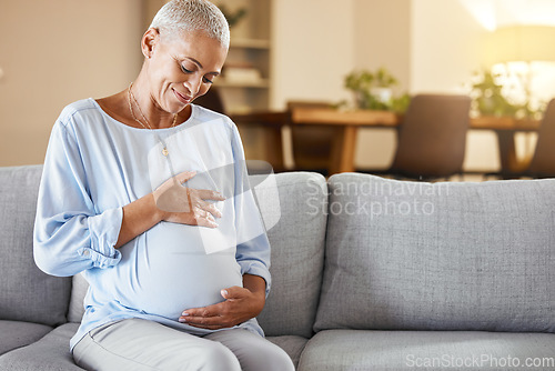 Image of Pregnant black woman, sofa and love for belly in home living room with smile, care and happy. Woman, pregnancy and happiness for future on couch in lounge with vision, thinking and holding stomach