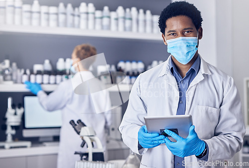 Image of Portrait, science and black man with mask, tablet and laboratory for vaccine, cure or healthcare. Medical professional, face cover or Nigerian male in lab, diagnosis for virus, innovation or research