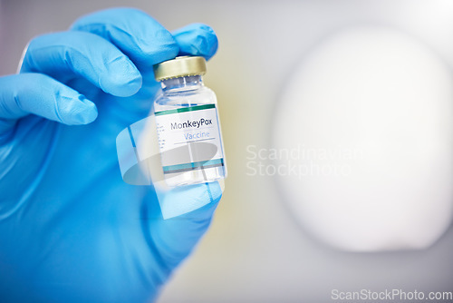 Image of Innovation, healthcare or hand with vaccine, medicine or product in bottle with a blurry or blurred background. Monkey pox, doctor or scientist working on medical cure or lab drugs in safety gloves