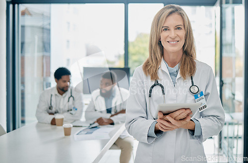 Image of Doctor, tablet and senior woman, leadership and health with medical innovation, technology and digital hospital schedule. Network, stethoscope and healthcare portrait with smile, success and vision.
