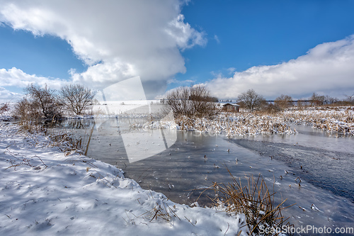 Image of winter rural landscape with pond