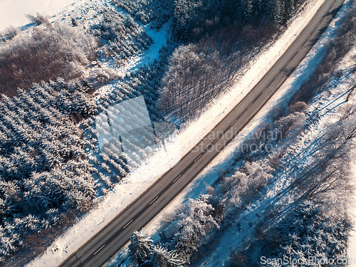 Image of Aerial view of winter road, in sunny day