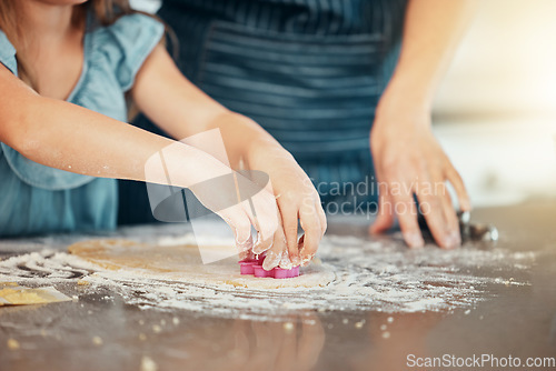 Image of Hands, baking and parent help kid with cooking in a home kitchen learning to prepare cookies or biscuits recipe. Development, table and mother teaching child a food hobby in a house together