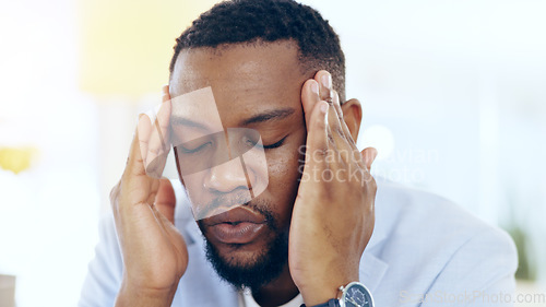 Image of Black man, headache and business stress from mistake, debt or financial crisis in burnout at office. Frustrated African businessman or employee in pain, anxiety or depression for fail at workplace