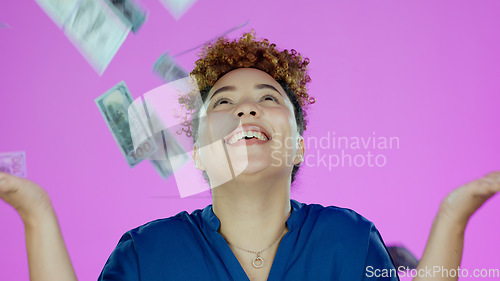 Image of Woman, winner and money rain and success, bonus or winning of lottery prize, profit or cashback in studio. Happy african person with cash in air, financial freedom and celebration a pink background
