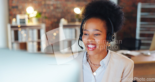 Image of Woman, call center and computer in night, talk and office for telemarketing, voip mic and contact us. African consultant, crm and tech support agent for customer care, ideas or questions at help desk